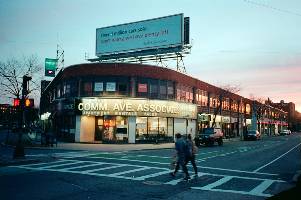 people walking on pedestrian lane during night time