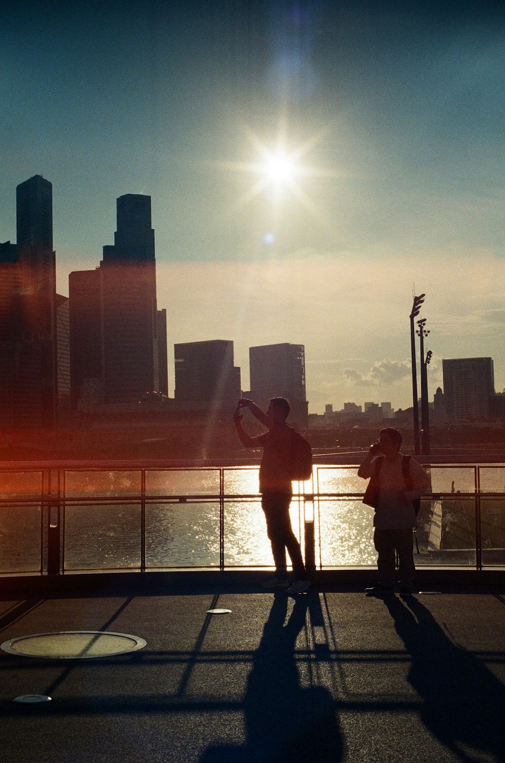 2 women walking on sidewalk during daytime