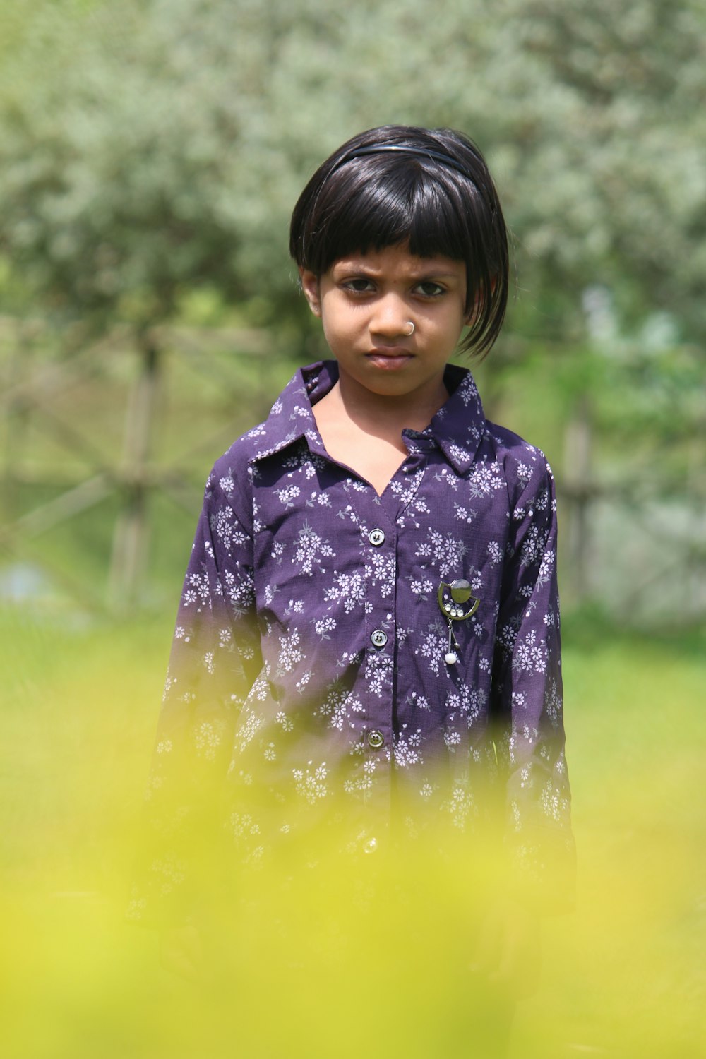 girl in blue and white floral button up shirt