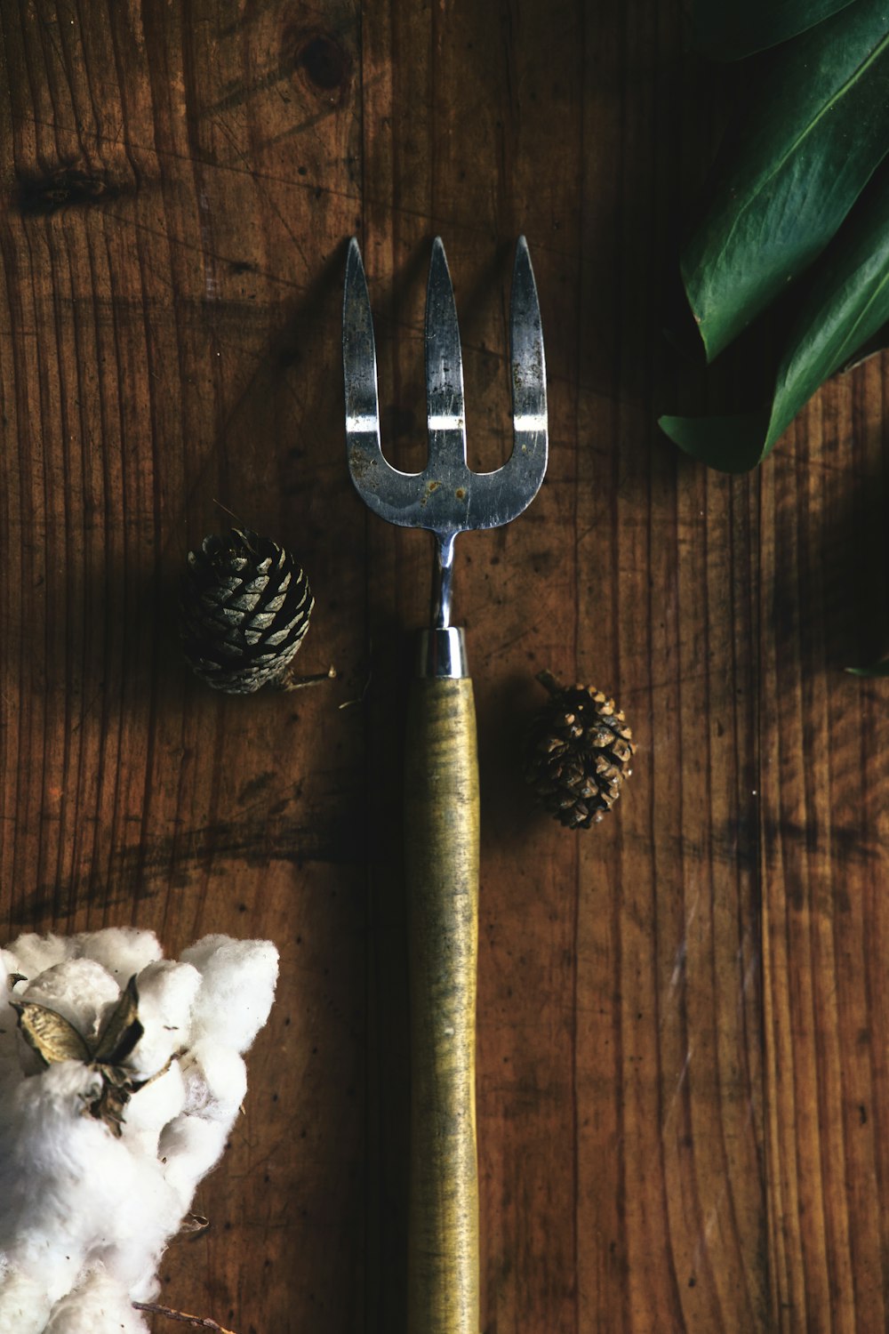 stainless steel fork beside white flowers