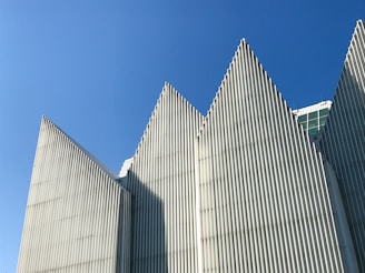 white concrete building under blue sky during daytime
