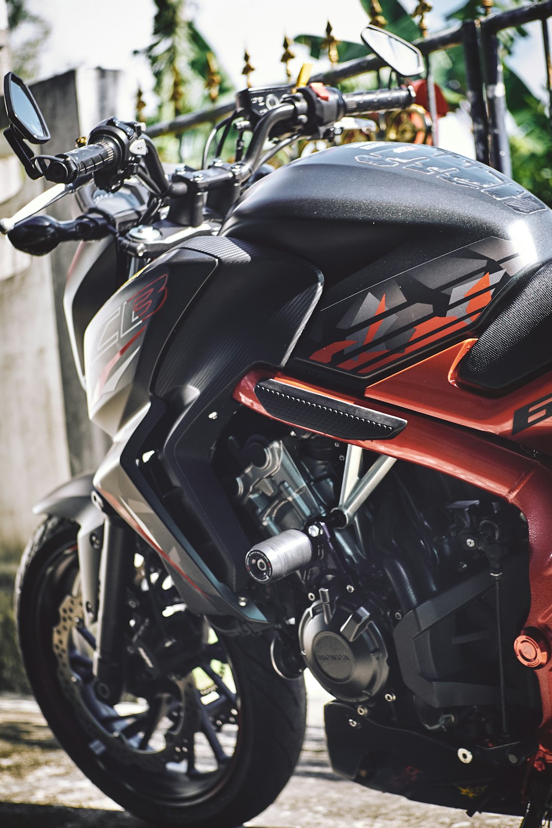 red and black honda motorcycle