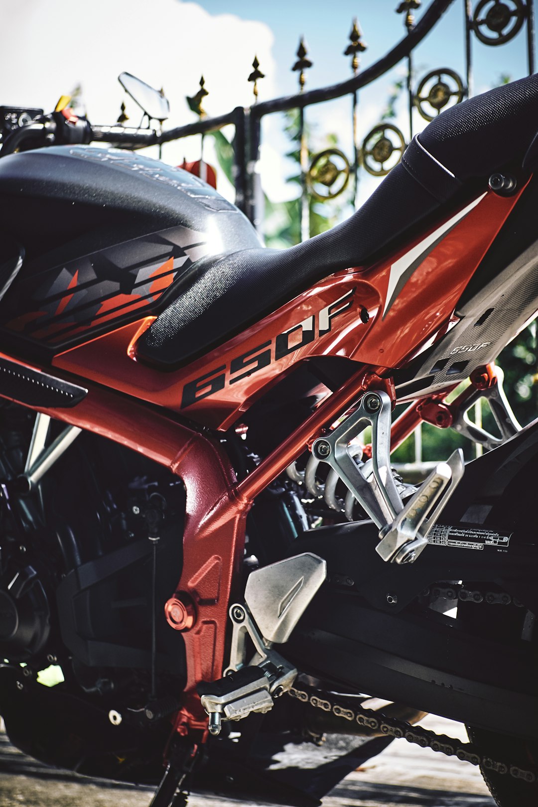 red and black motorcycle in close up photography