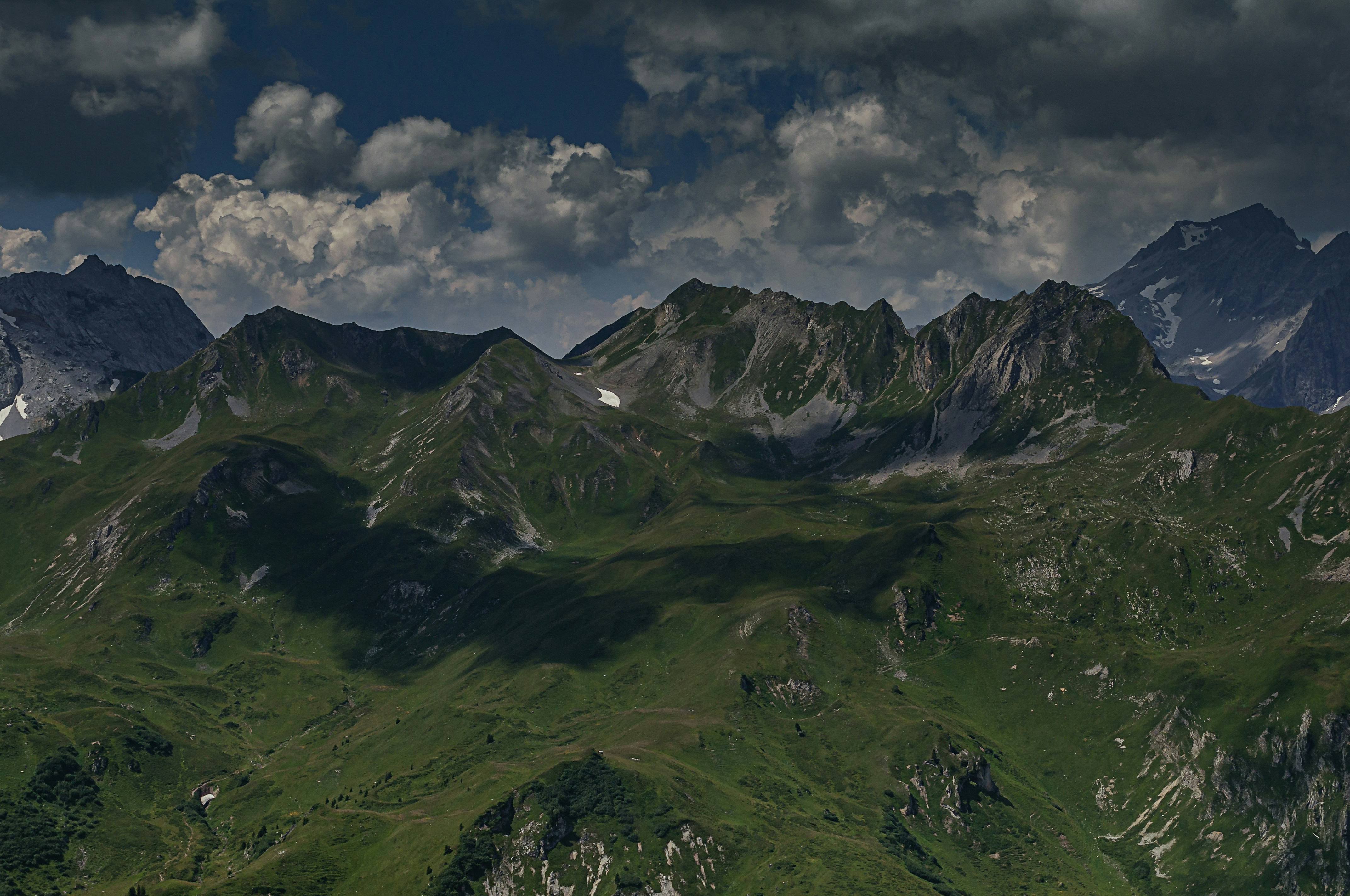 green and black mountains under white clouds and blue sky during daytime, mountain golm austria