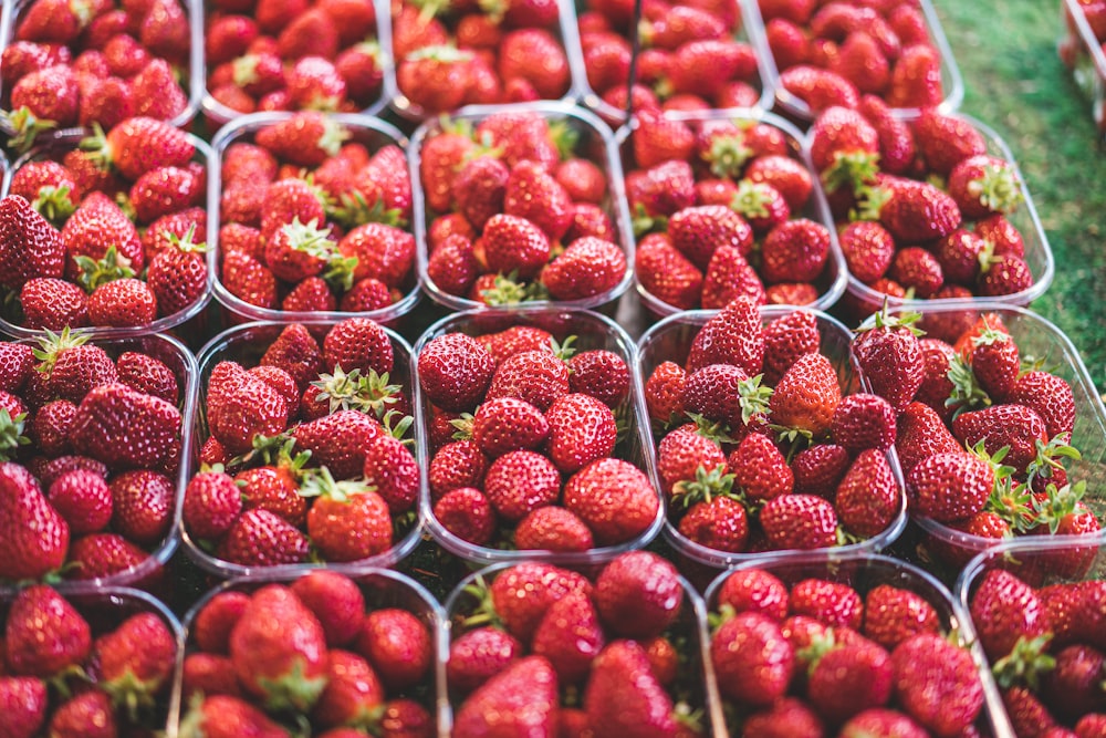 red strawberries in clear plastic container