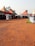 A vibrant desert scene with colorful tents and people enjoying a lively gathering.