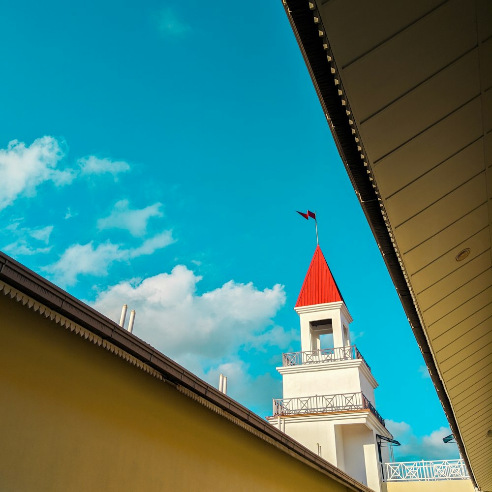 white and red concrete building under blue sky during daytime