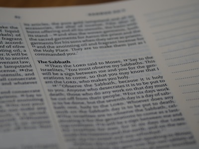 A close-up of a page from a book, specifically focusing on a section titled 'The Sabbath'. The text is printed in a serif font and includes a passage discussing religious observance. The right side of the page shows lined sections for note-taking.