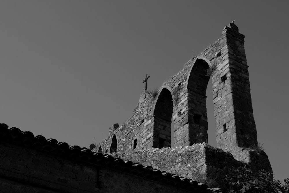 gray scale photo of brick building