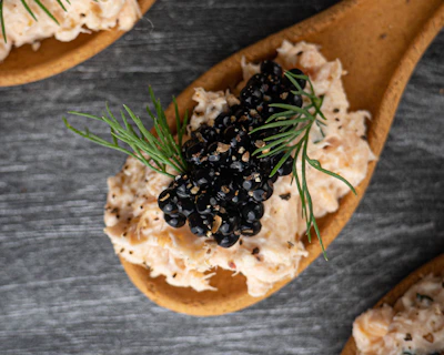 Close-up of shimmering Almas caviar pearls in a delicate mother-of-pearl spoon.