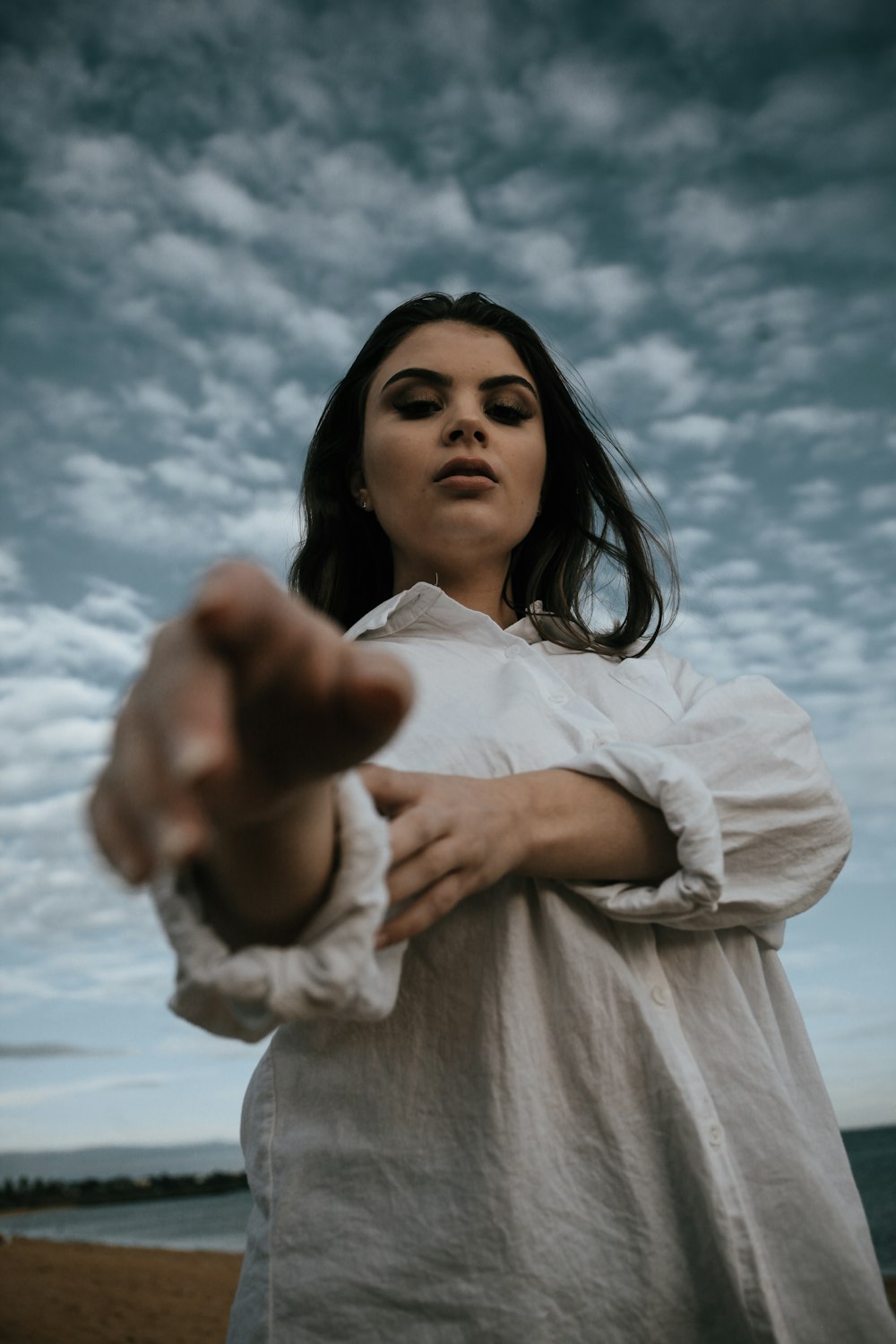 woman in white long sleeve shirt