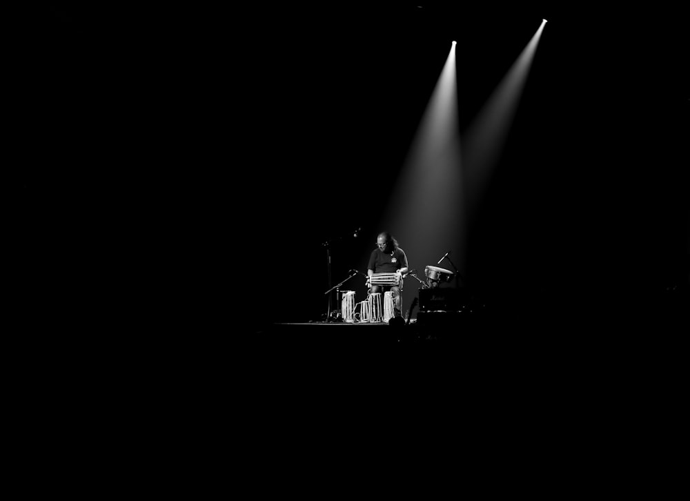 man playing guitar on stage