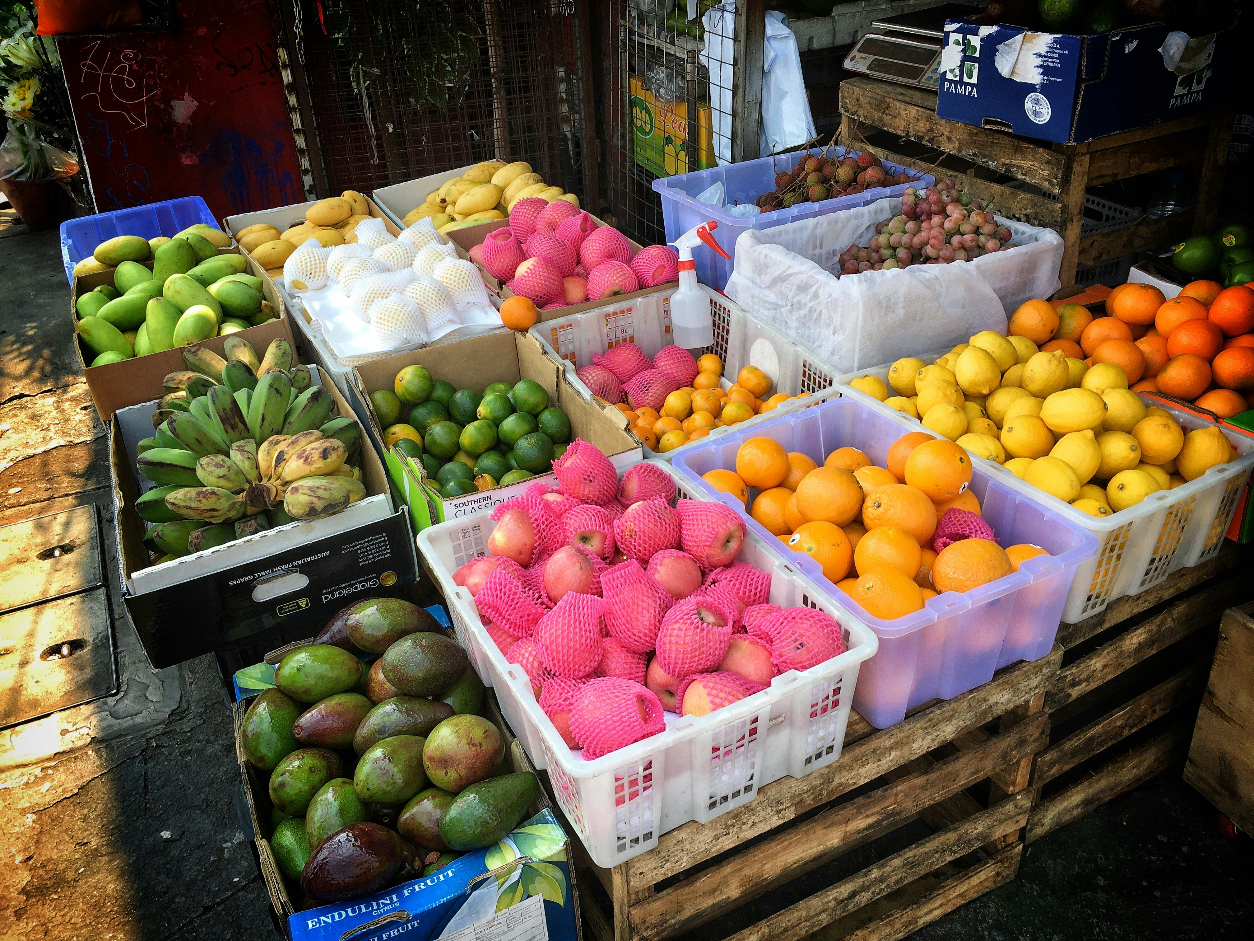 Colorful fresh fruit market display with abundant tropical and exotic fruits