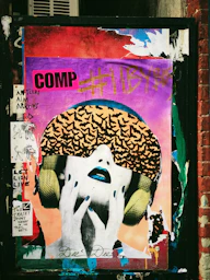 graffiti on a wall above a store