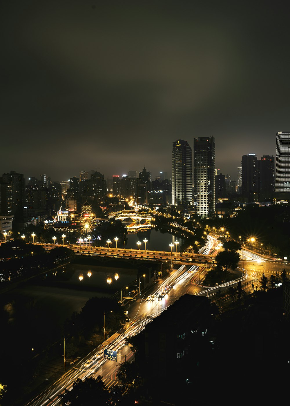 city with high rise buildings during night time