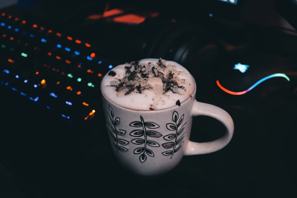 white and black ceramic mug with white and black liquid