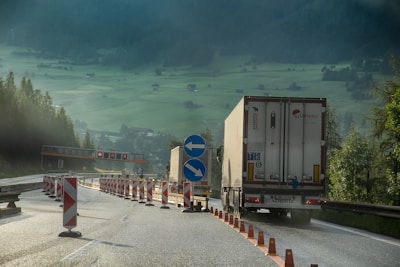 white and blue truck on road during daytime