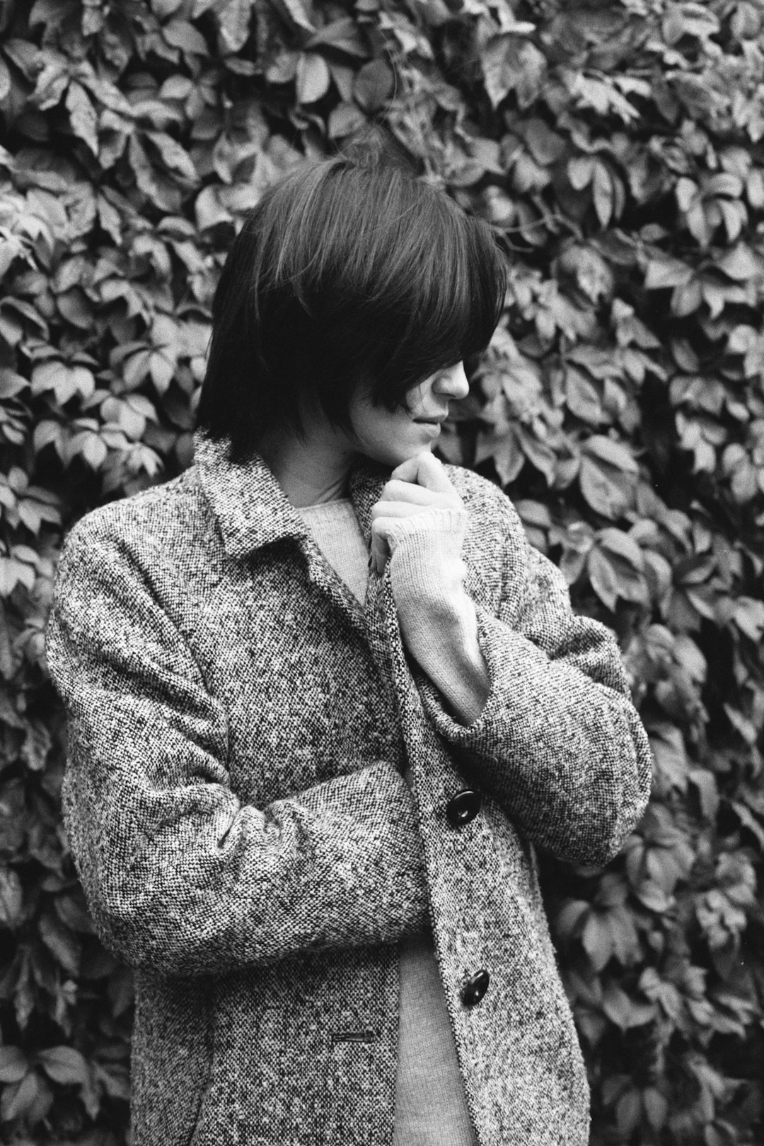grayscale photo of woman in coat