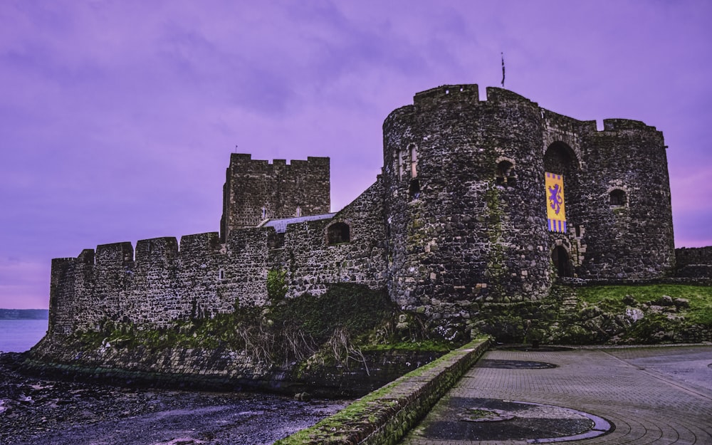 gray concrete castle under cloudy sky during daytime