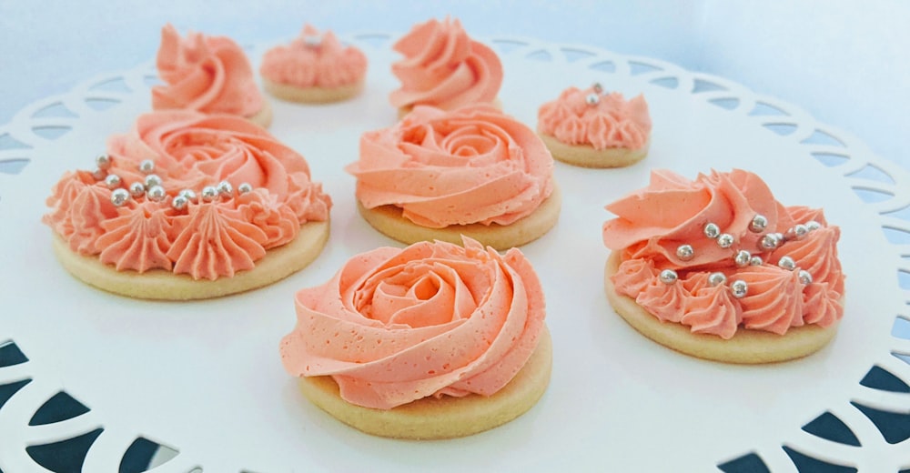 pink and brown cupcake on white surface