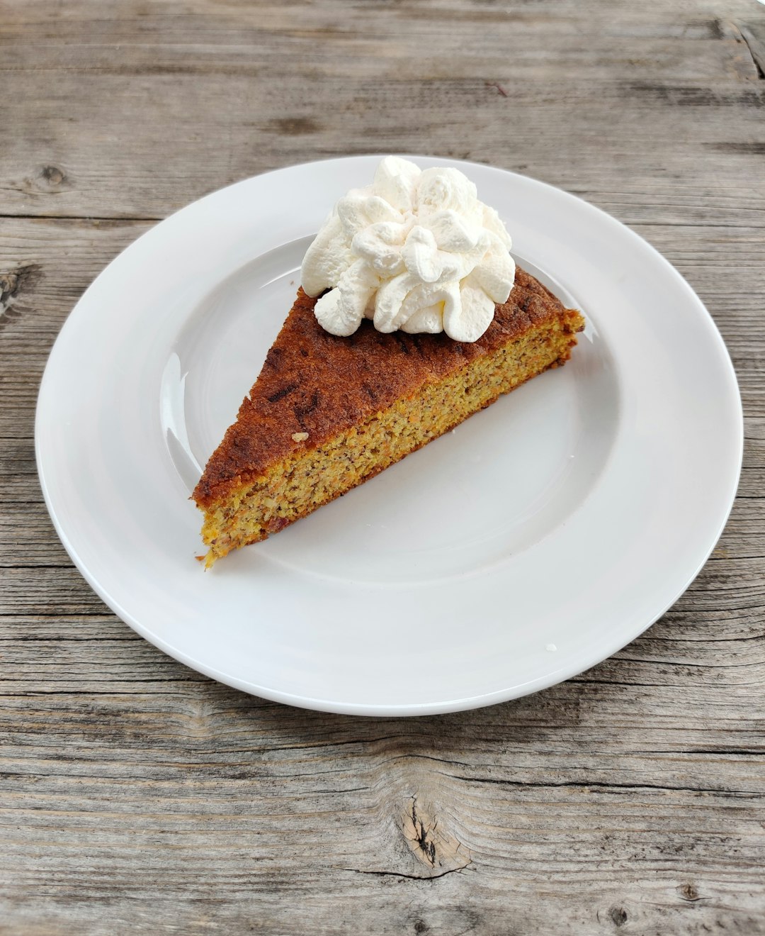 brown and white cake on white ceramic plate