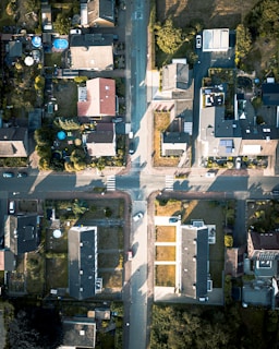 Aerial shot of a suburban neighborhood with diverse housing styles.