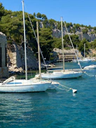 white boat on body of water during daytime