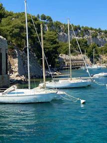 white boat on body of water during daytime