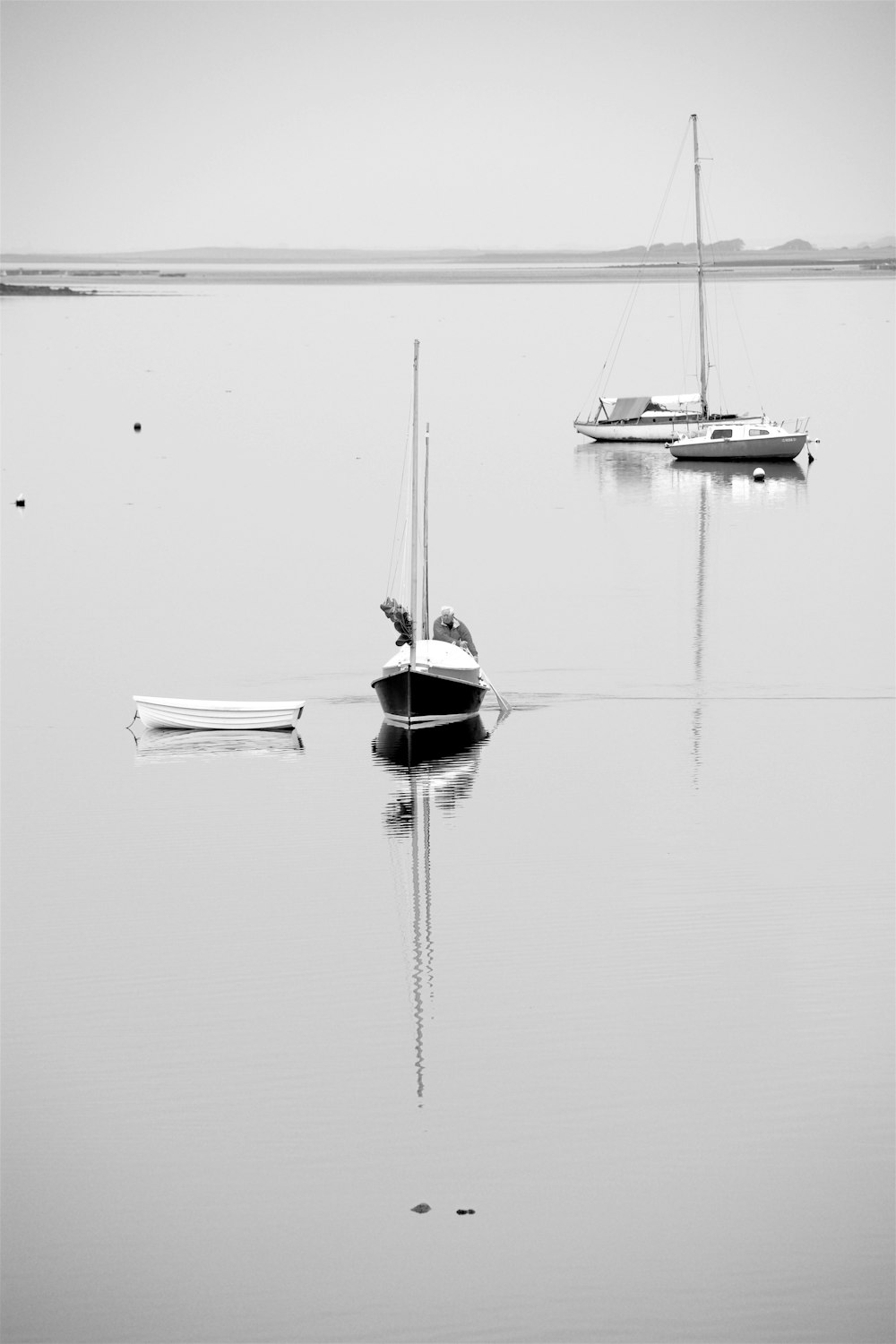 grayscale photo of boat on water