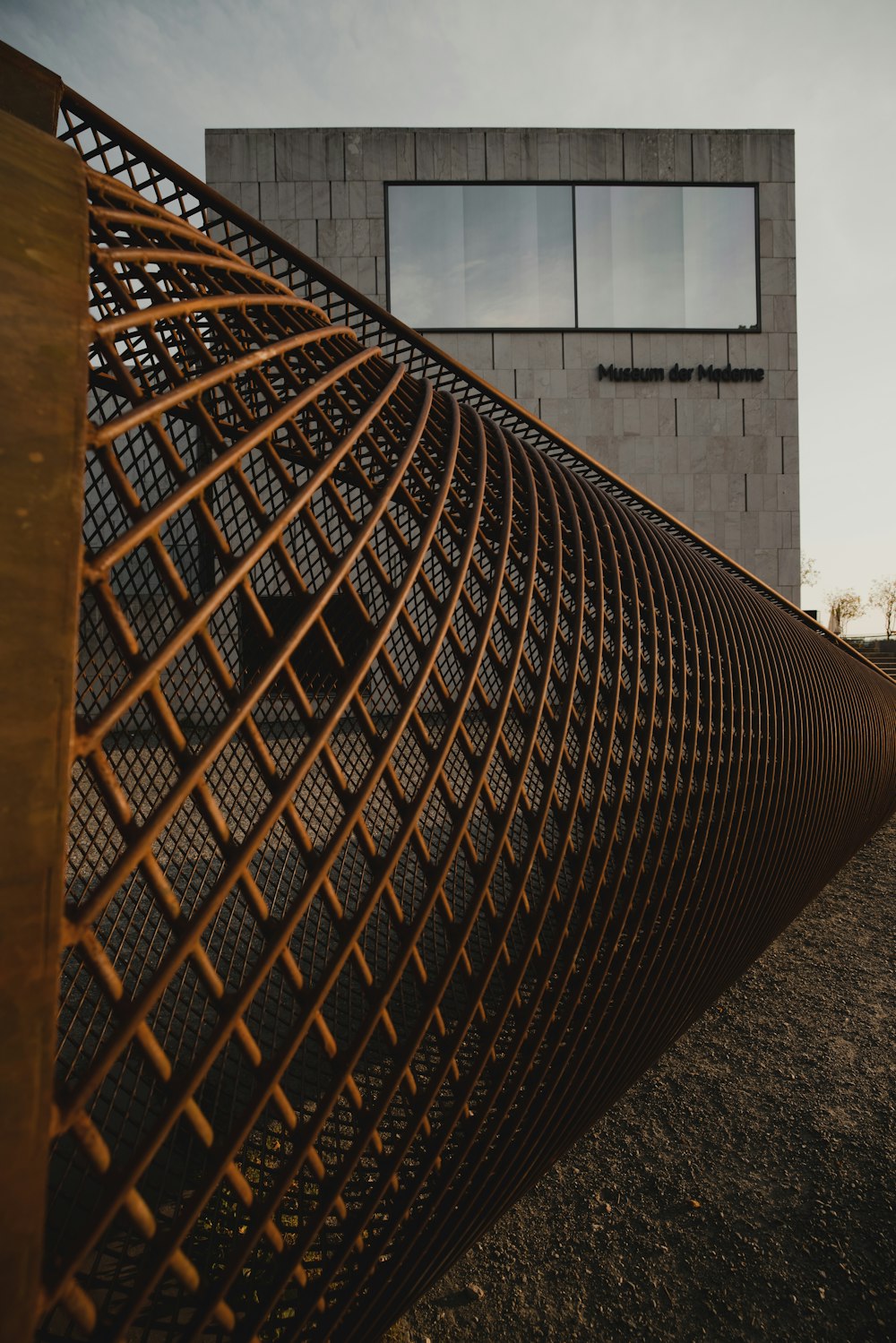 brown wooden frame near white concrete building during daytime