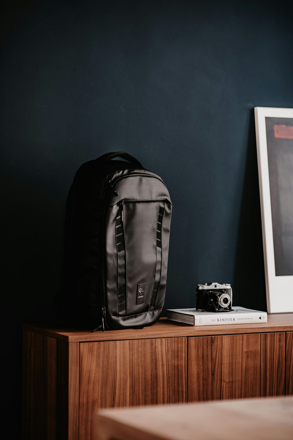 black backpack on brown wooden table