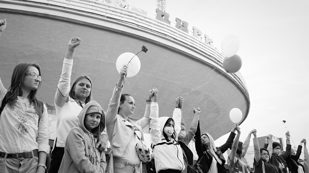 A group of diverse people holding hands in solidarity against corruption.