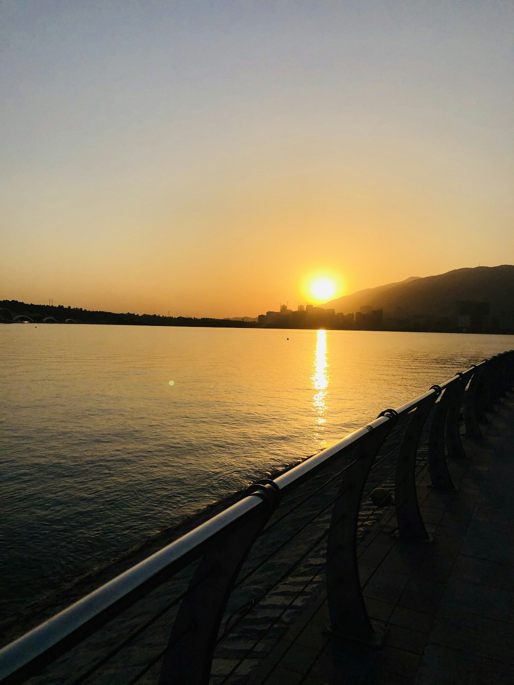 body of water during sunset