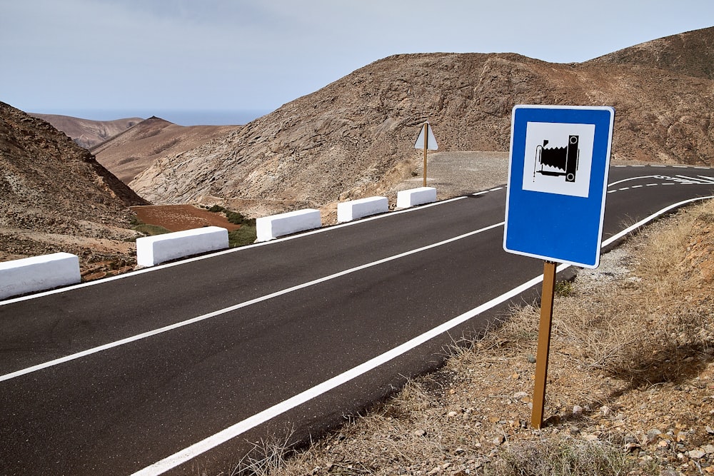 blue and white road sign