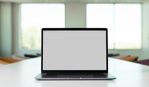 macbook pro on white table