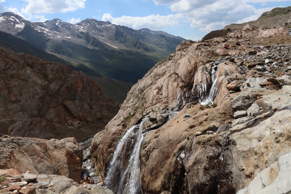 brown rocky mountain under white cloudy sky during daytime