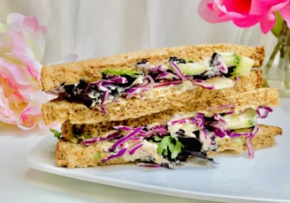 brown bread with pink and white flowers on white ceramic plate