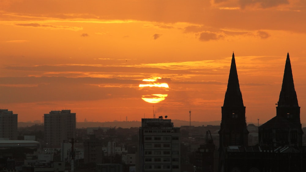 silhouette of buildings during sunset