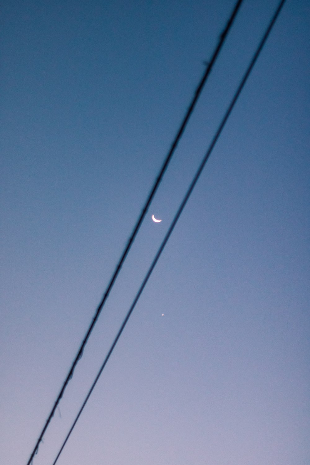 black coated wire under blue sky