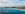 white boats on sea under cloudy sky during daytime