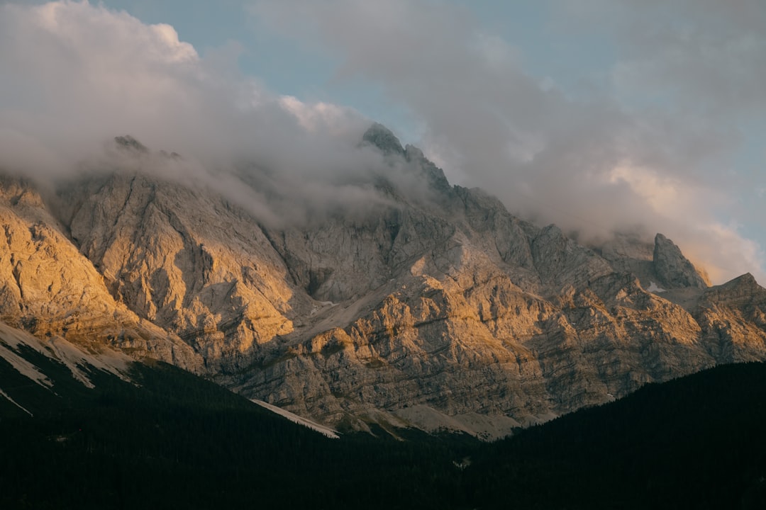 gray and white mountain under white clouds