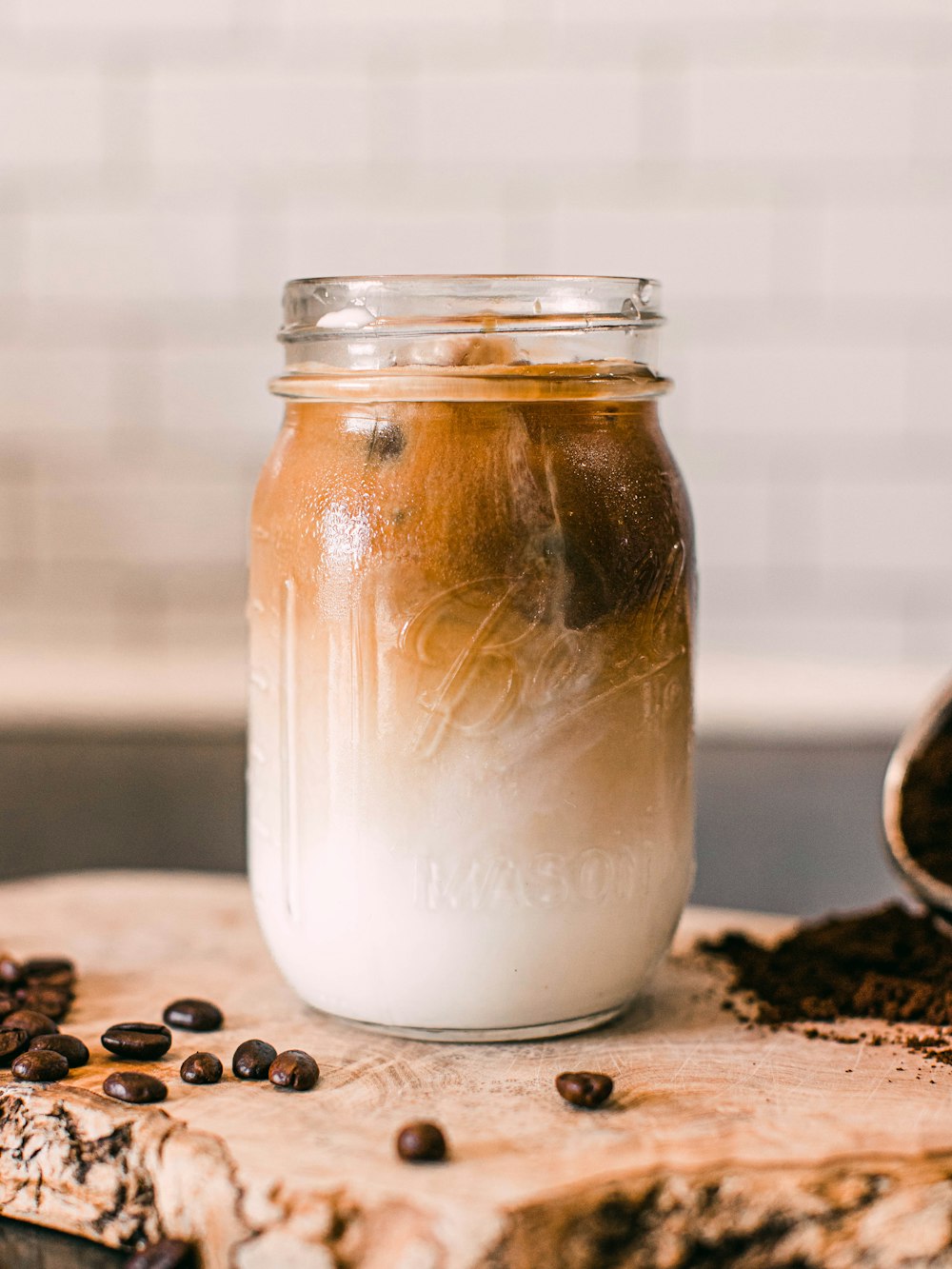 clear glass jar with brown liquid inside