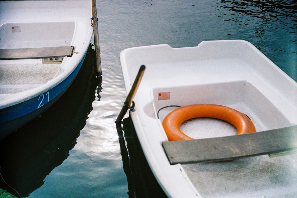 white and blue boat on water during daytime