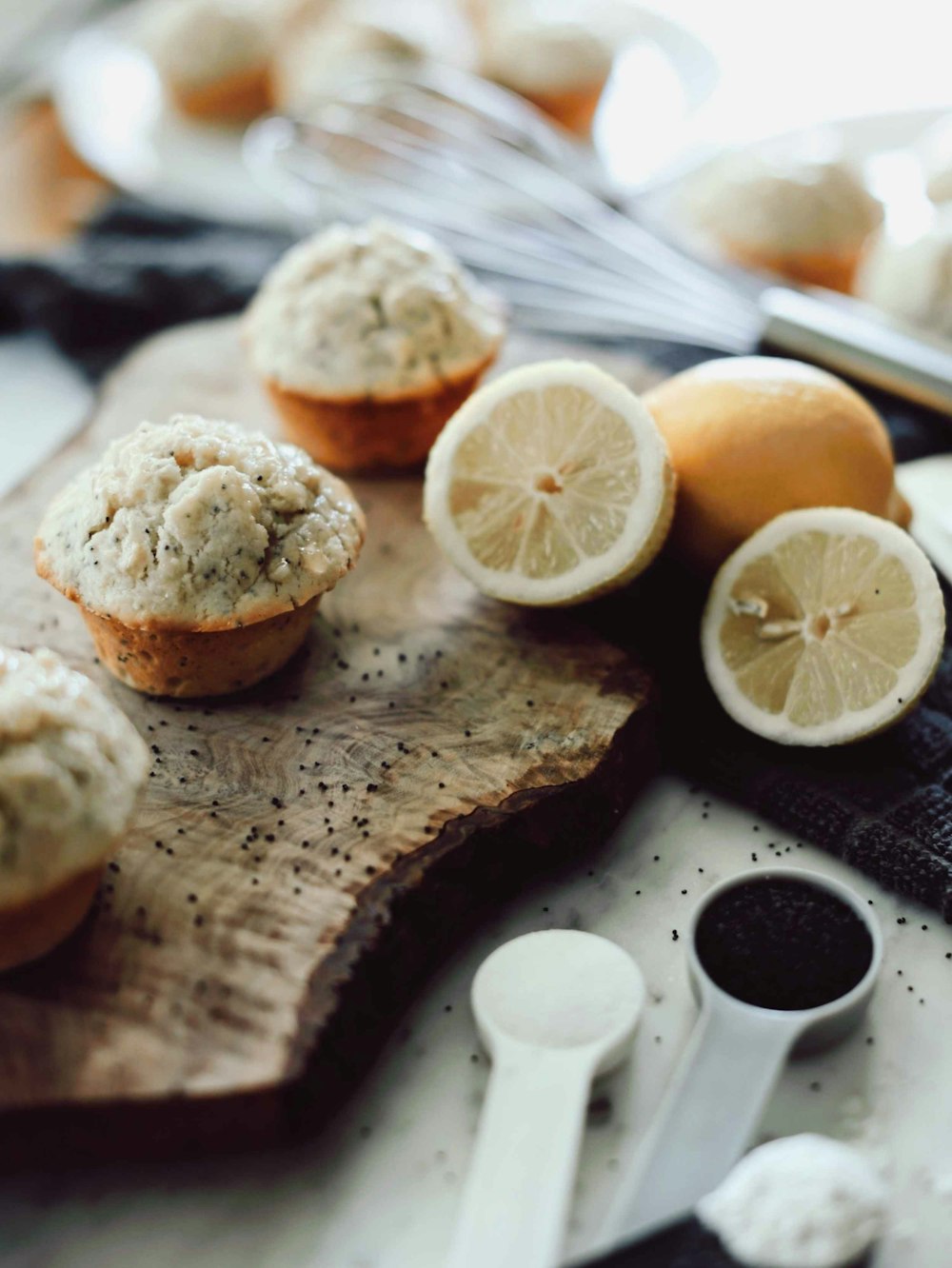 sliced lemon beside sliced lemon on brown wooden chopping board