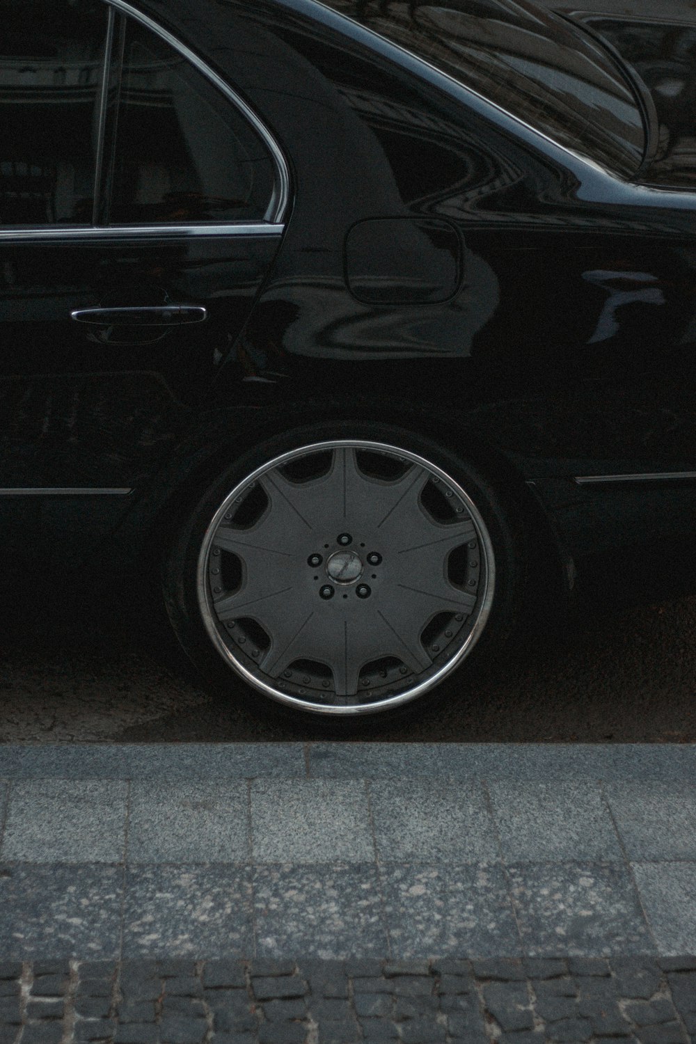 black car on gray asphalt road