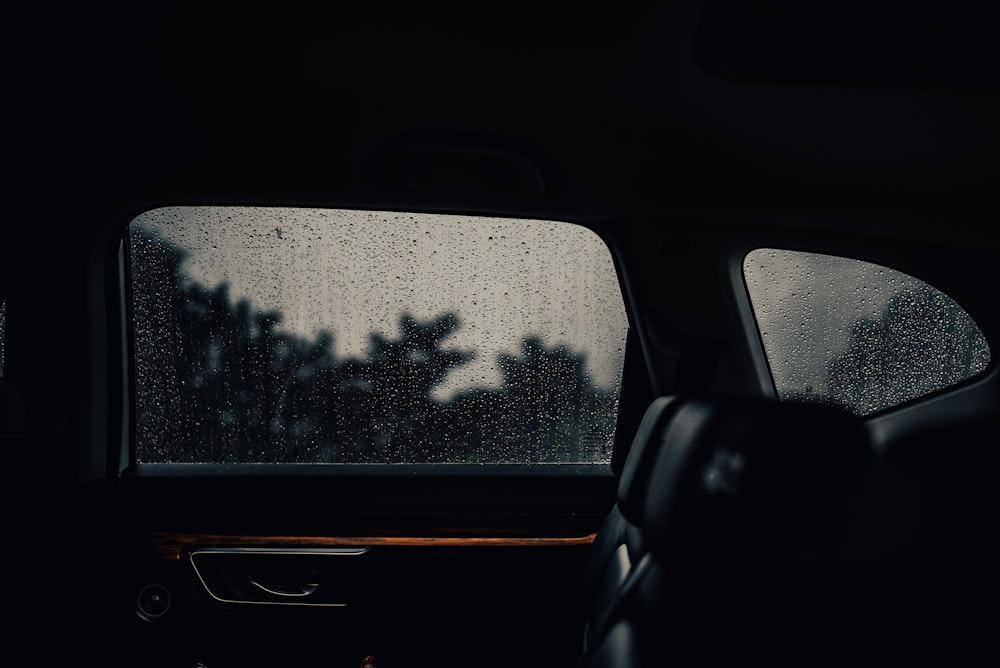 black car door with water droplets