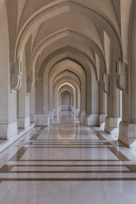 people walking on brown and white hallway