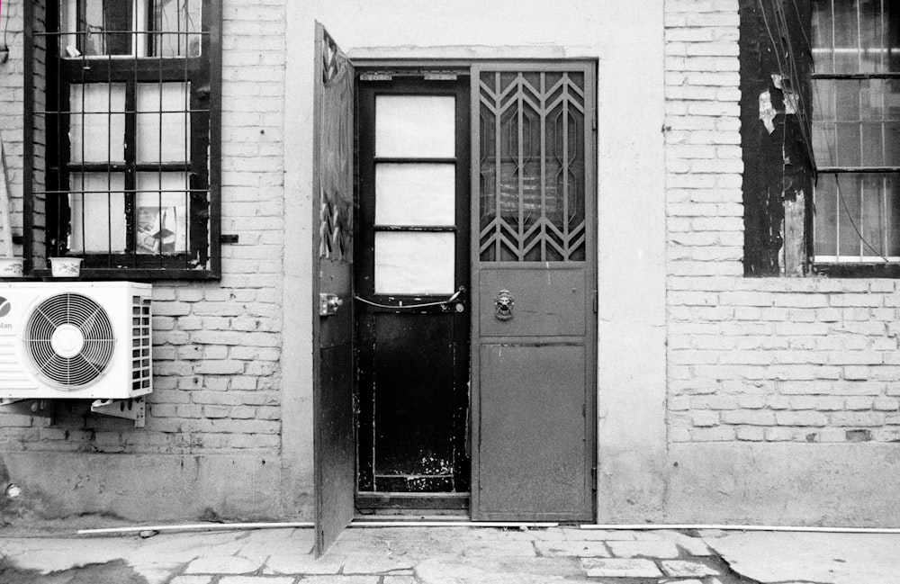 grayscale photo of closed door