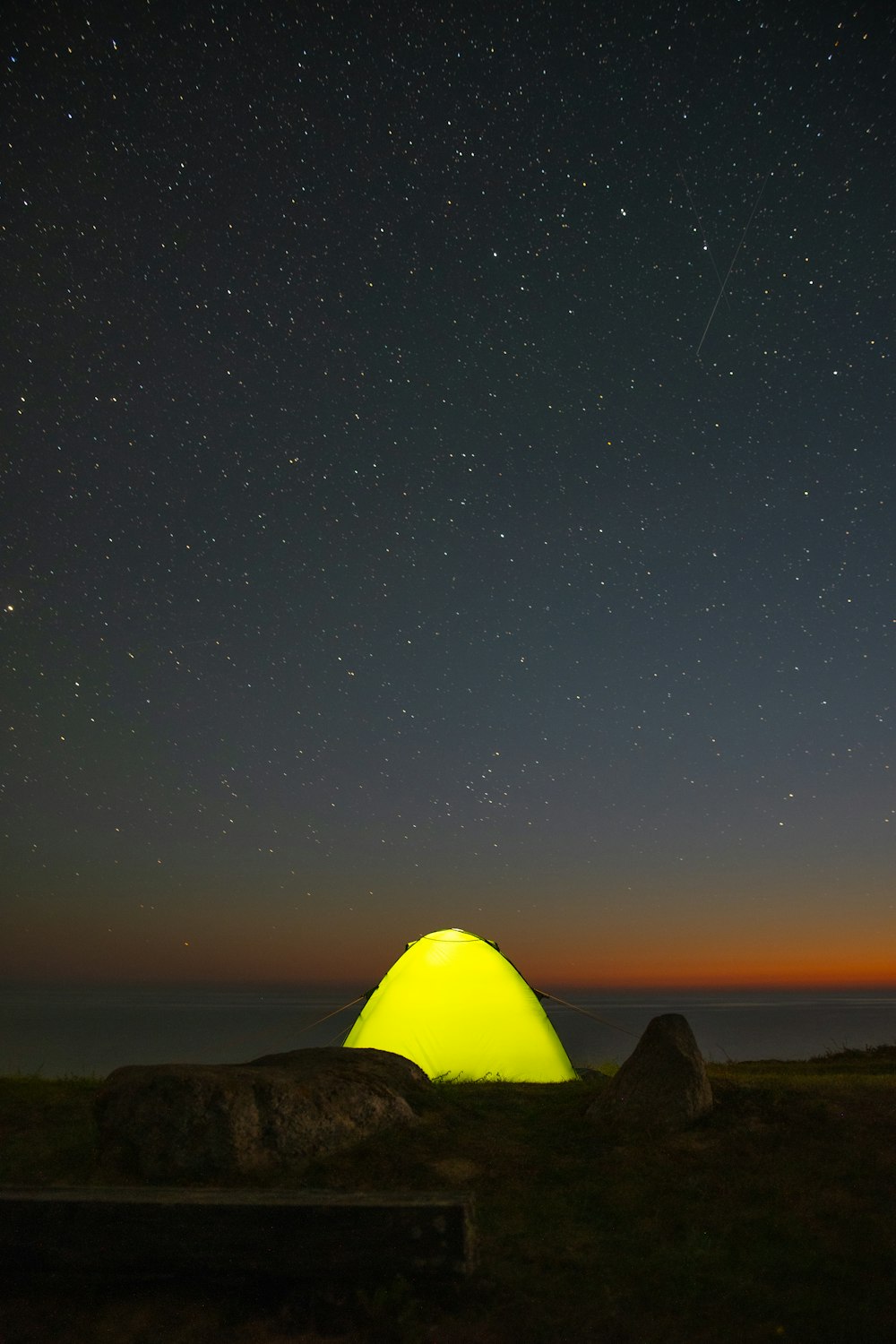 silhouette of mountain under blue sky during night time