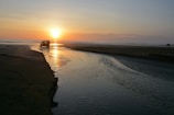body of water during sunset
